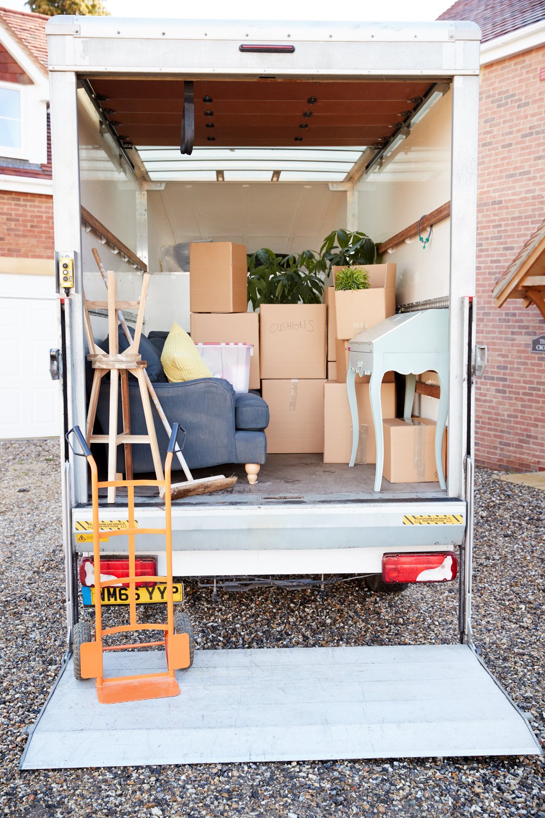 Removal Truck Waiting to Be Unloaded outside New Home 